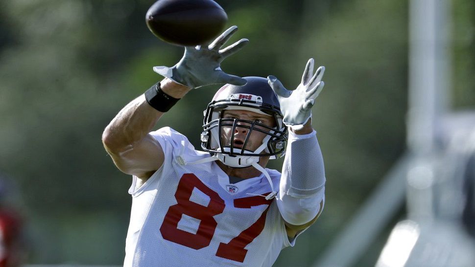 In this file photo from August 13, new Buccaneers tight end Rob Gronkowski catches a pass during organized team activities.  Gronkowski came out of retirement and was acquired by Tampa Bay from the Patriots in April, as he reunites with quarterback Tom Brady.  (AP Photo, Chris O'Meara, File)