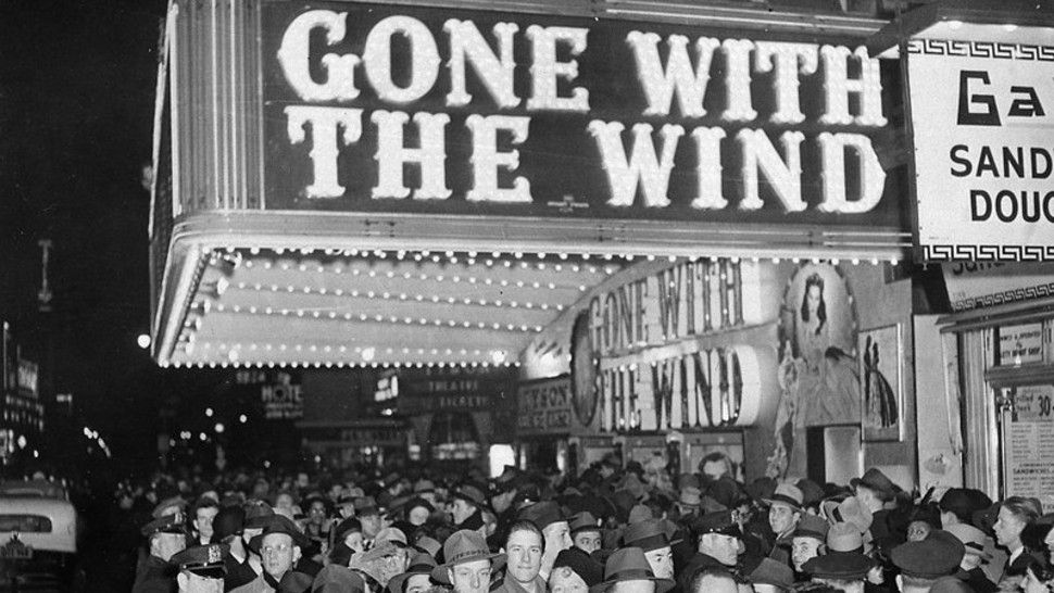 FILE - In this Dec. 19, 1939 file photo, a crowd gathers outside the Astor Theater on Broadway during the premiere of "Gone With the Wind" in New York. HBO Max has temporarily removed “Gone With the Wind” from its streaming library in order to add historical context to the 1939 film long criticized for romanticizing slavery and the Civil War-era South. (AP Photo)