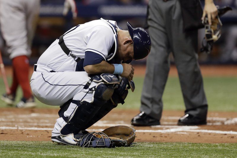 Tampa Bay Rays catcher Wilson Ramos doubles over after getting hurt on a pitch from Austin Pruitt during the third inning of a baseball game against the Boston Red Sox Tuesday, May 22, 2018, in St. Petersburg, Fla. Ramos left the game. (AP Photo/Chris O’Meara)