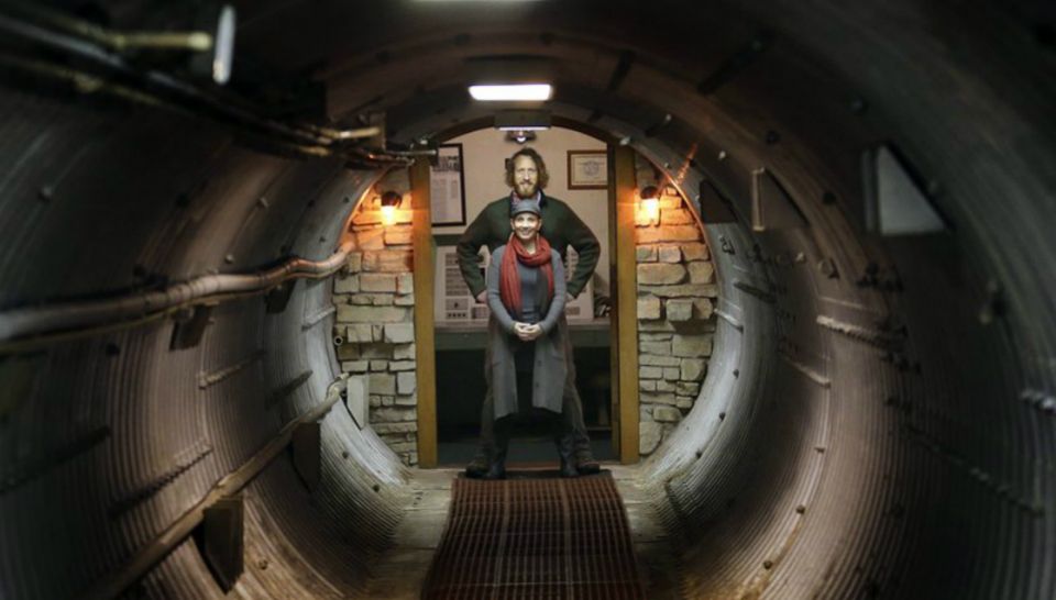 In this Nov. 2, 2017 photo, Mathew Fulkerson and his wife Leigh Ann pose at their Subterra Airbnb located in a former underground missile silo base near Eskridge, Kan. The Subterra Castle Airbnb opened for business about six months ago. (Courtesy: Thad Allton/The Topeka Capital-Journal via AP)