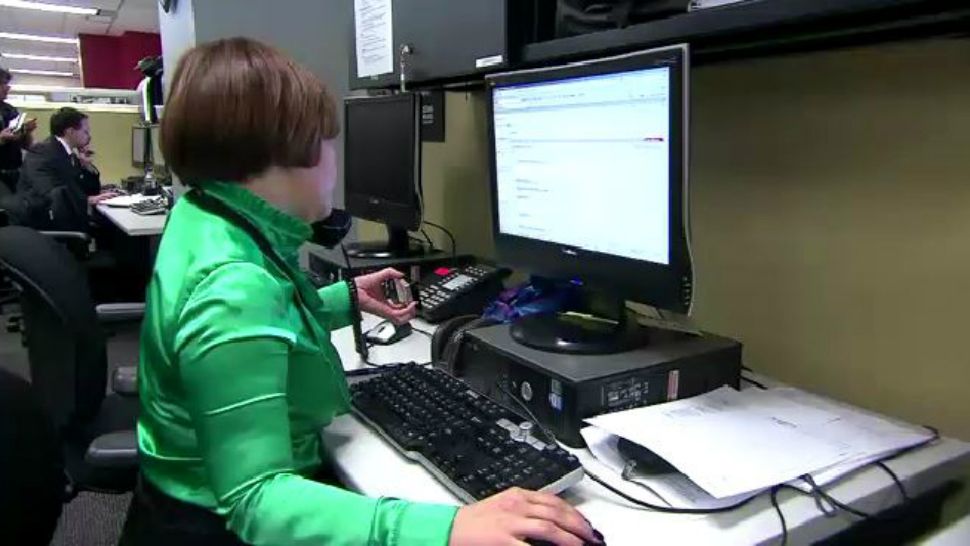 Woman working at a computer (Spectrum News file footage)