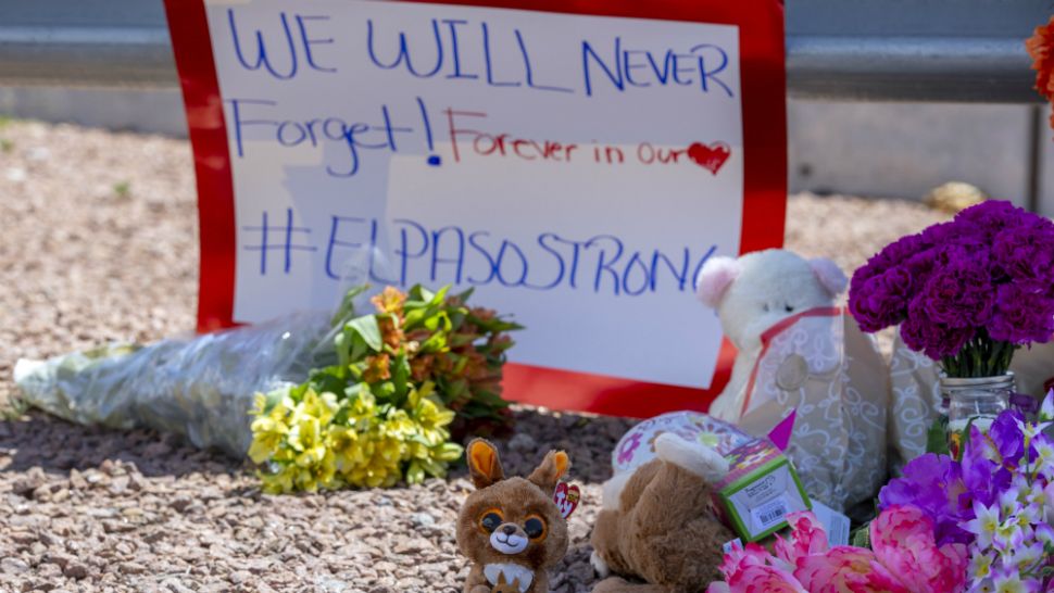 Flowers and toys adorn a makeshift memorial for the victims of Saturday mass shooting at a shopping complex in El Paso, Texas, Sunday, Aug. 4, 2019. (AP Photo/Andres Leighton)