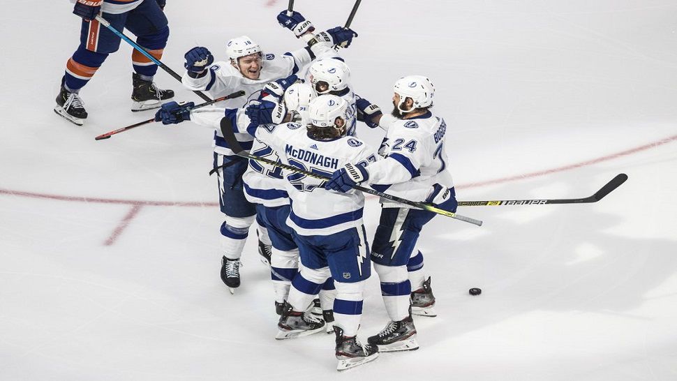 The Tampa Bay Lightning celebrate after Brayden Point's 3rd-period goal vs. the Islanders.  The Bolts won Game 4 4-1 and now hold a 3-1 series lead in the Eastern Conference Final.  (Jason Franson/The Canadian Press via AP)