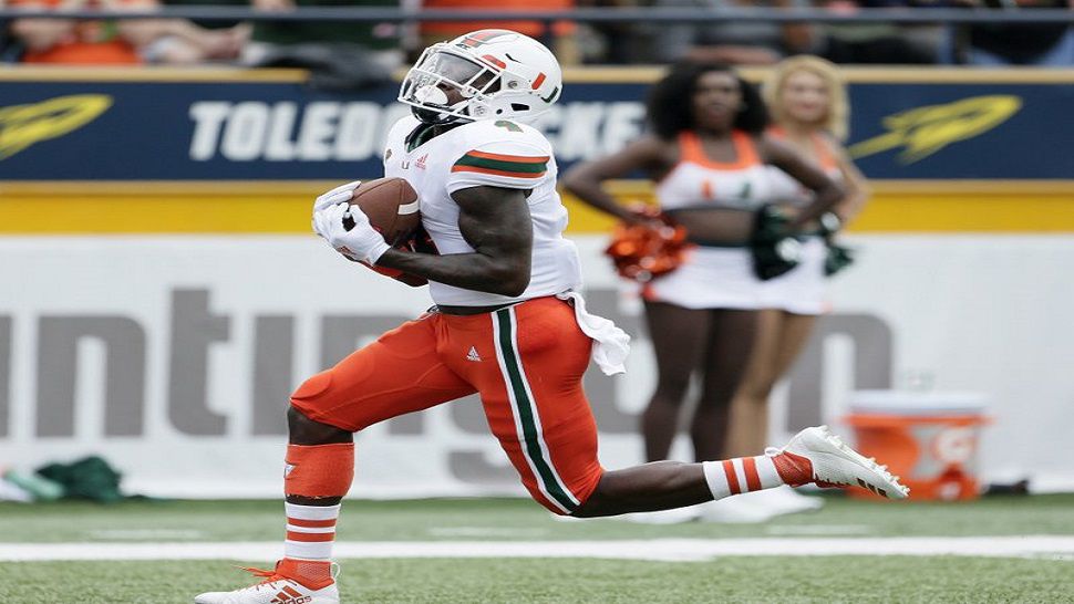 Miami WR Jeff Thomas catches a touchdown pass against Toledo in the Hurricanes' 49-28 win over the Rockets. (AP Photo/Duane Burleson)