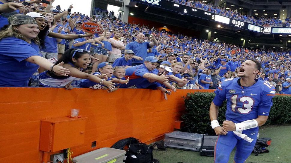 Florida quarterback Feleipe Franks (13) celebrates with fans after he threw a 63-yard touchdown pass as time expired to defeat Tennessee 26-20 last year in Gainesville, Fla. Franks still gets goosebumps every time he sees a replay. (AP Photo/John Raoux, File)