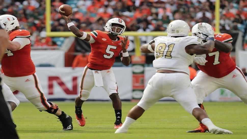 Miami redshirt freshman N'Kosi Perry (5) passes during the first half of the Hurricanes win over FIU.  Perry finished the day with three TD passes and 224 passing yards. (AP Photo/Lynne Sladky)