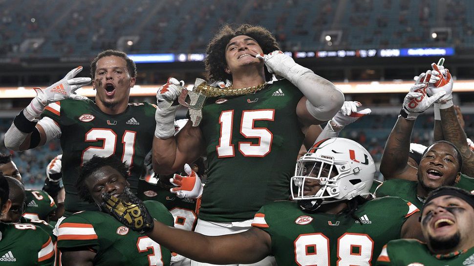 Miami lineman Jaelan Phillips displays the turnover chain after intercepting a Seminoles pass during the first half of the Hurricanes' dismantling of Florida State.  Miami's 42-point win was their largest margin of victory in the series since 1976.  (Michael Laughlin/South Florida Sun-Sentinel via AP)