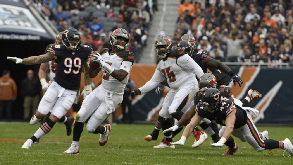 Tampa Bay Buccaneers quarterback Jameis Winston (3) scrambles during the second half of the Bucs loss to the Bears on Sunday. It was Winston's first appearance of the season, coming off of a three-game suspension.  (AP Photo/David Banks)