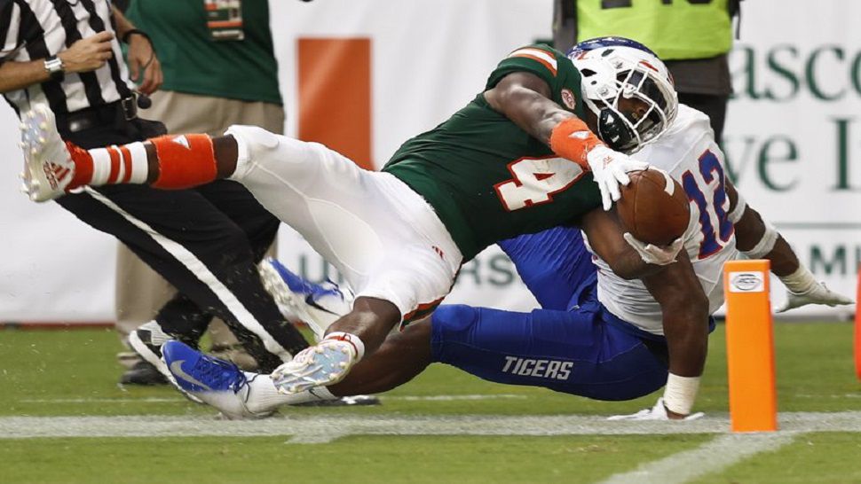 Miami WR Jeff Thomas (4) scores a touchdown against Savannah State in the first half of their record-breaking 77-0 rout. (AP Photo/Brynn Anderson)