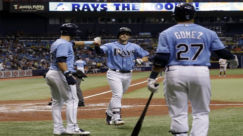 Rays rookie Brandon Lowe, center, high-fives Kevin Kiermaier, left, and Carlos Gomez, right, after his three-run home run in Tampa Bay's 8-3 win over Baltimore. (AP Photo/Chris O’Meara)