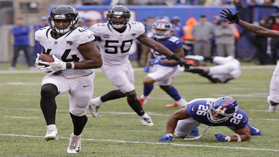 Jacksonville Jaguars’ linebacker Myles Jack runs back an interception for a touchdown during a 20-15 win over the New York Giants. (AP Photo/Seth Wenig)