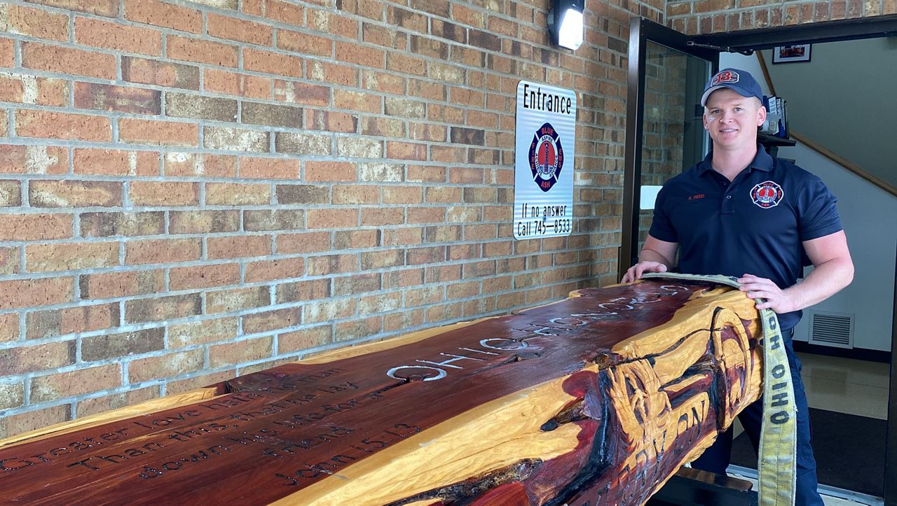Firefighters use log the size of casket to honor victims