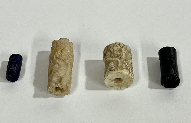 Four cylinder seals returned to Iraq by the Manhattan District Attorney's Office. The office said in a release the pieces could be dated between 2,700 B.C.E. and 539 B.C.E. and were used as official signatures by individuals or businesses. (Courtesy of the Manhattan District Attorney's Office)
