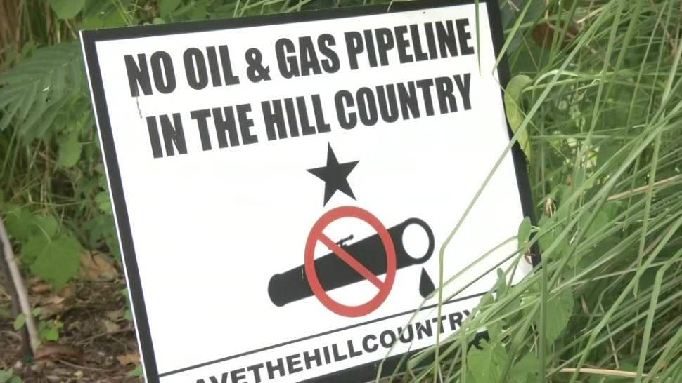 A sign protesting the Kinder Morgan pipeline (Spectrum News mages)