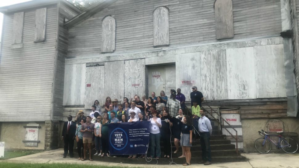 A group of people stands in front of the San Marcos Historic First Baptist Church (Spectrum News file image)