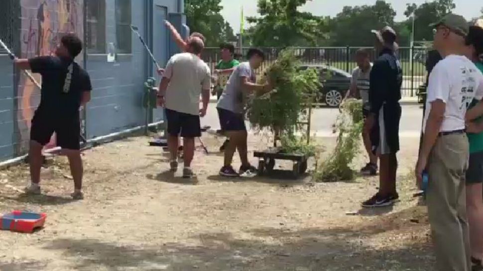 Central Catholic and Holy Cross high schools work together on a service project (Spectrum News footage)