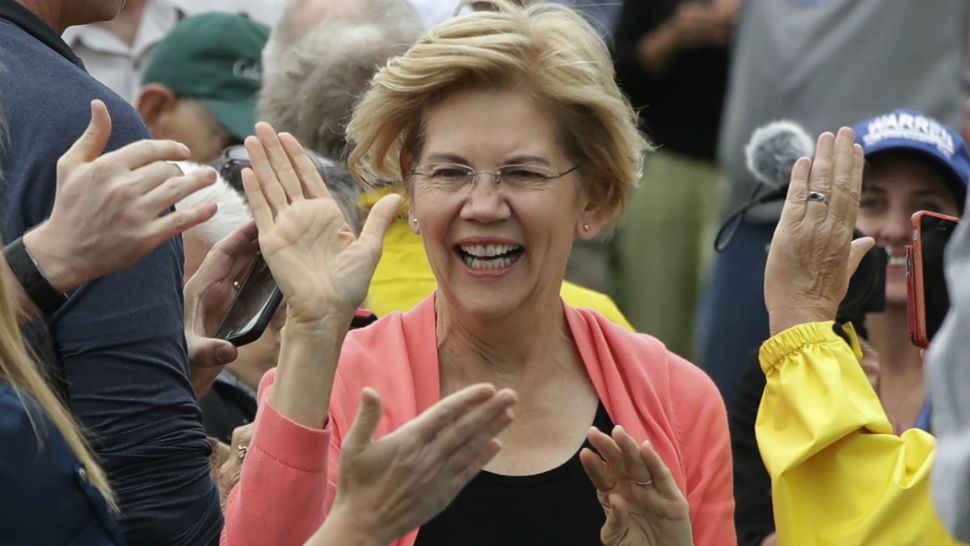 Democratic presidential candidate Sen. Elizabeth Warren, D-Mass., greets people as she arrives to a campaign event, Monday, Sept. 2, 2019, in Hampton Falls, N.H. (AP Photo/Elise Amendola)
