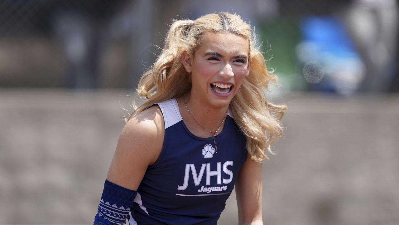 AB Hernandez of Jurupa Valley smiles while completing in the girls long jump during the CIF Southern Section Masters Meet at Moorpark High School, Saturday, May 24, 2025, in Moorpark, Calif. (Kirby Lee via AP)