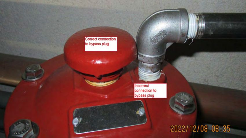 An image from the investigation's report shows the improperly installed air vacuum valve. (Photo courtesy of the Navy)