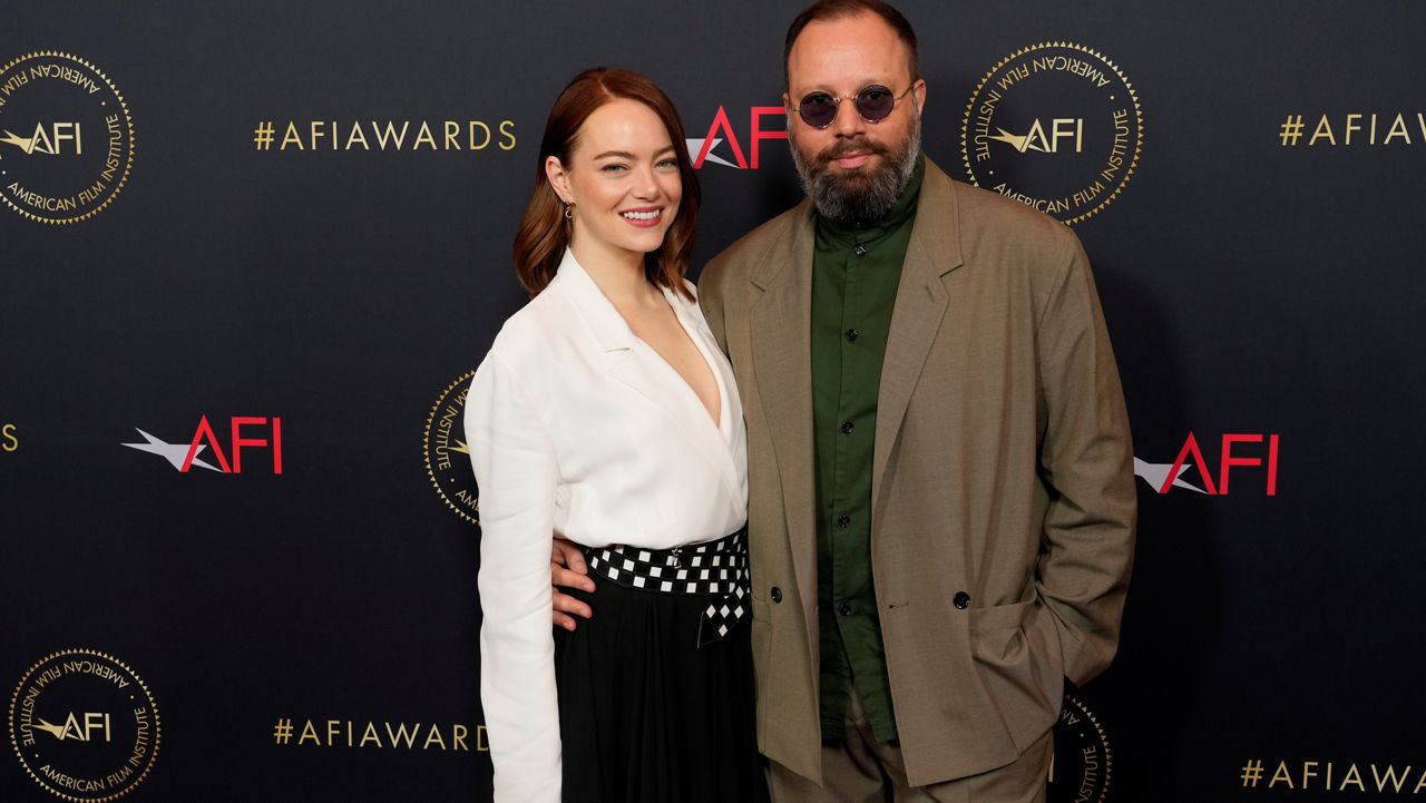 Emma Stone, left, and Yorgos Lanthimos arrive at the AFI Awards on Friday, Jan. 12, 2024, at the Four Seasons Beverly Hills in Beverly Hills, Calif. (AP Photo/Chris Pizzello)