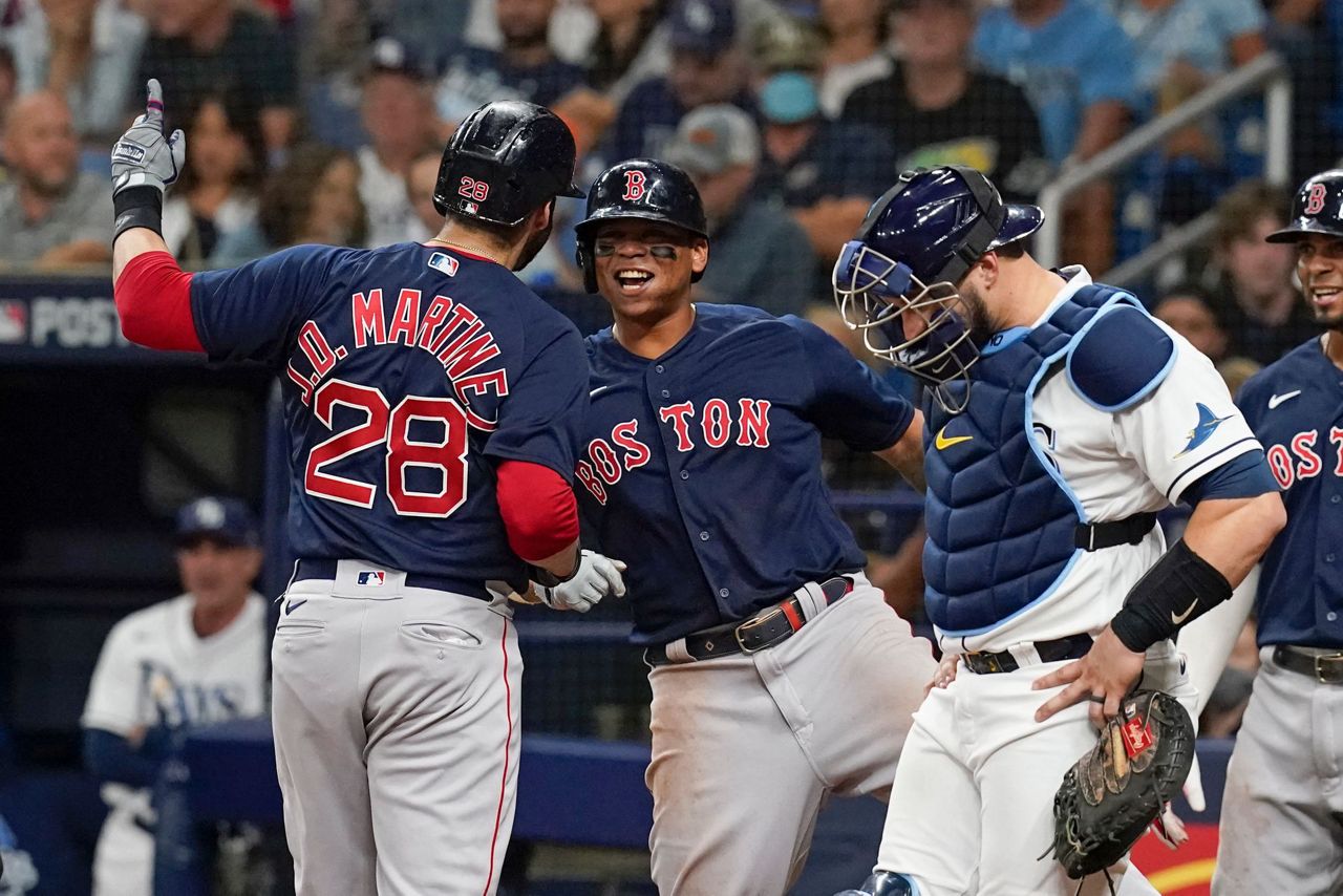 Boston Red Sox's J.D. Martinez celebrates after hitting a solo