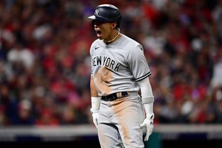 Cleveland Guardians' Amed Rosario (1) and Steven Kwan, right, celebrate  after defeating the Tampa Bay Rays in a wild card baseball playoff game,  Friday, Oct. 7, 2022, in Cleveland. (AP Photo/David Dermer