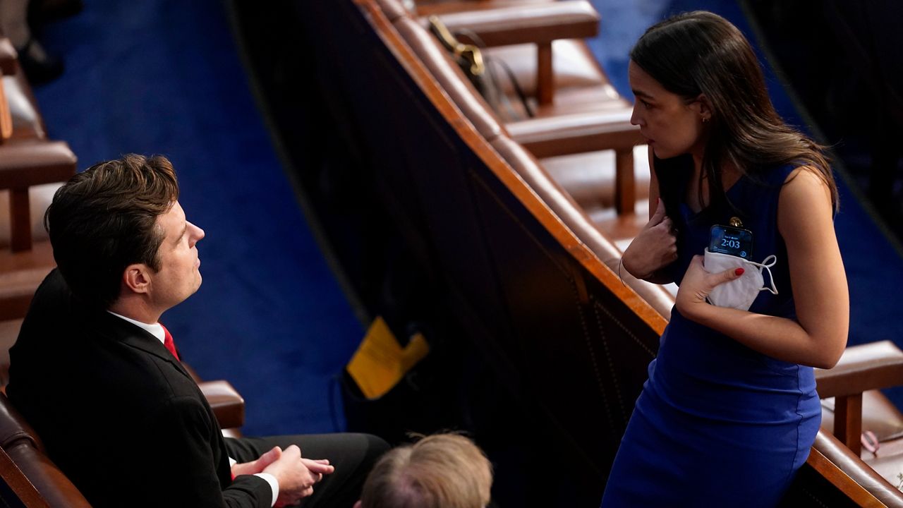Rep. Alexandria Ocasio-Cortez, D-N.Y., talks with Rep. Matt Gaetz, R-Fla., during opening day of the 118th Congress at the U.S. Capitol, Tuesday, Jan 3, 2023, in Washington. (AP Photo/Andrew Harnik)