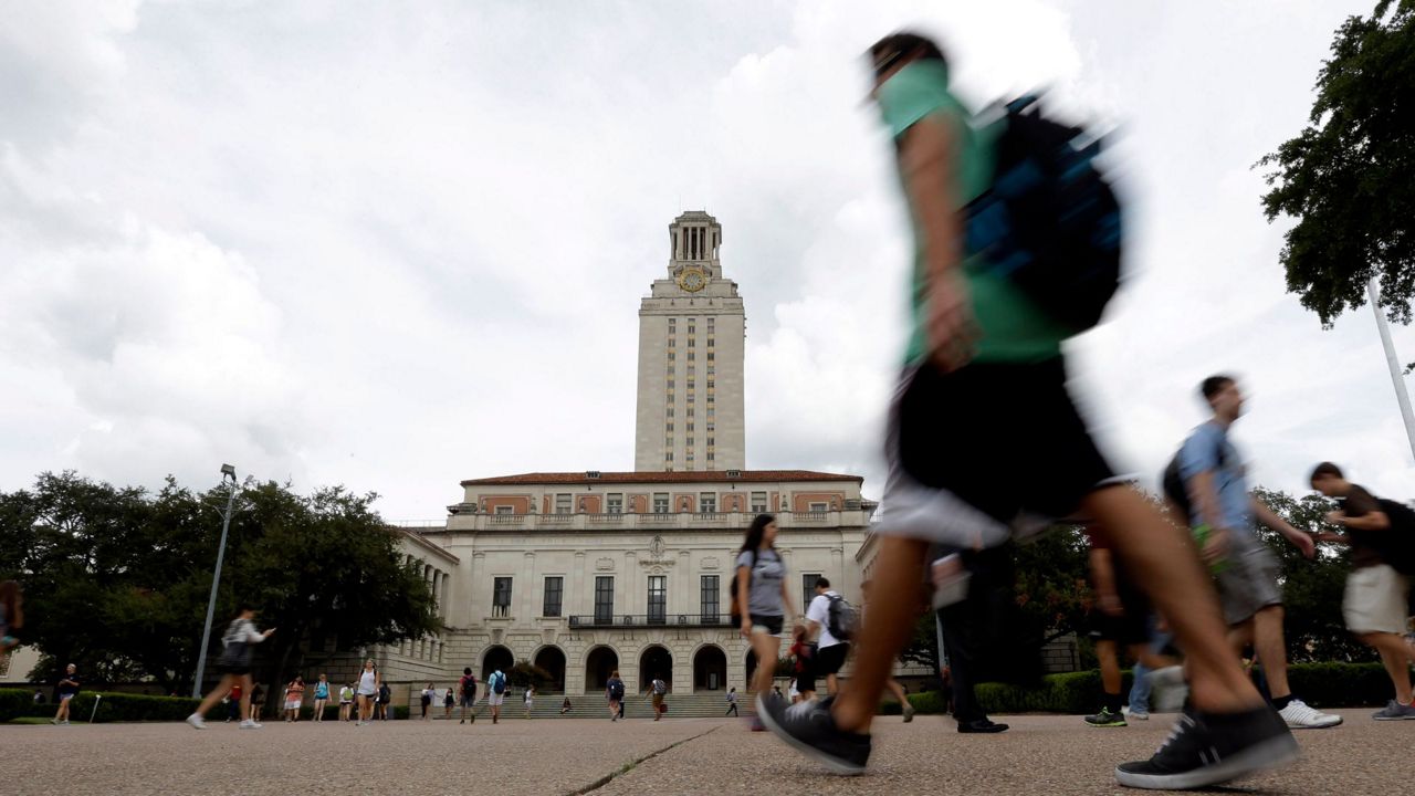 Texas students walk past the university's iconic tower, Thursday, Sept. 27, 2012, in Austin. The University of Texas is one of the most diverse in the country. (AP Photo/Eric Gay)