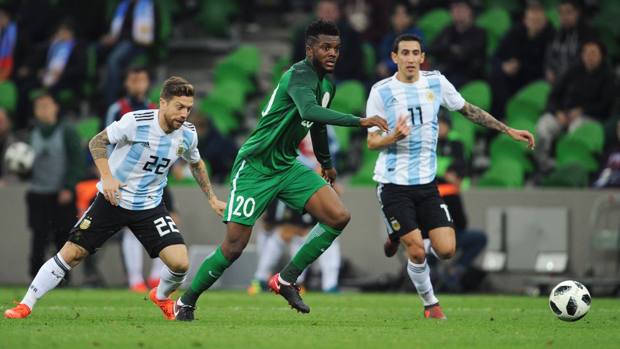 Nigeria's Chidozie Awaziem takes the ball forward watched by Argentina's Angel Di Maria, right, and Alejandro Dario Gomez, left during the international friendly soccer match between Argentina and Nigeria in Krasnodar, Russia, Tuesday, Nov. 14, 2017.