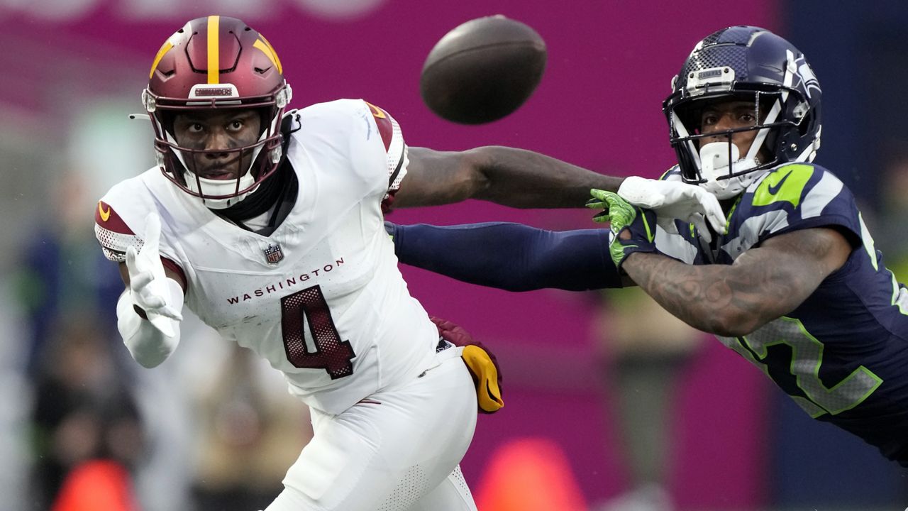 FILE - Washington Commanders wide receiver Curtis Samuel (4) looks to catch a pass during an NFL football game against the Seattle Seahawks, Sunday, Nov. 12, 2023 in Seattle. (AP Photo/Ben VanHouten, File)