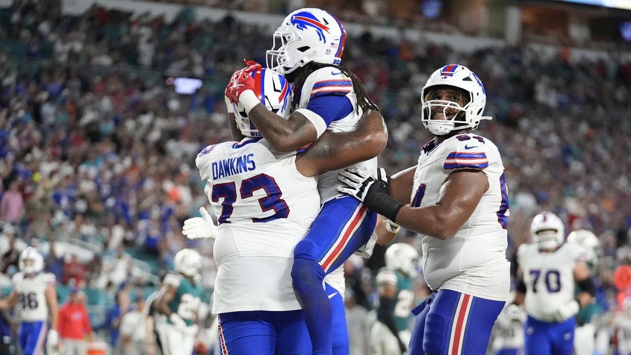 Buffalo Bills running back James Cook (4), center, celebrates his touchdown during the first half of an NFL football game Miami Dolphins, Thursday, Sept. 12, 2024, in Miami Gardens, Fla. (AP Photo/Rebecca Blackwell)