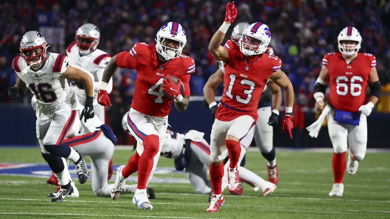 Buffalo Bills running back James Cook (4) carries the ball for a touchdown against the New England Patriots during the second quarter of an NFL football game, Sunday, Dec. 22, 2024, in Orchard Park, N.Y.. (AP Photo/Jeffrey T. Barnes)