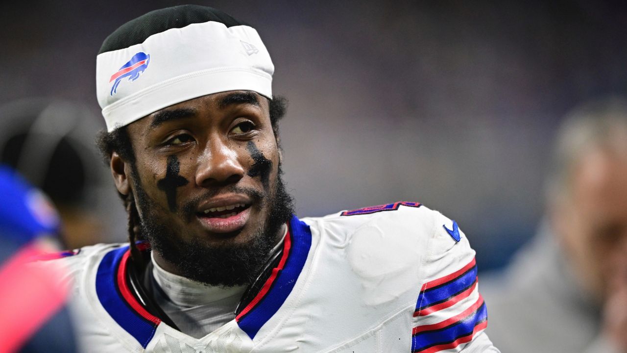 FILE - Buffalo Bills running back James Cook talks on the sideline during the second half of an NFL football game against the Detroit Lions in Detroit, Sunday, Dec. 15, 2024. The Bills won 48-42. (AP Photo/David Dermer, File)