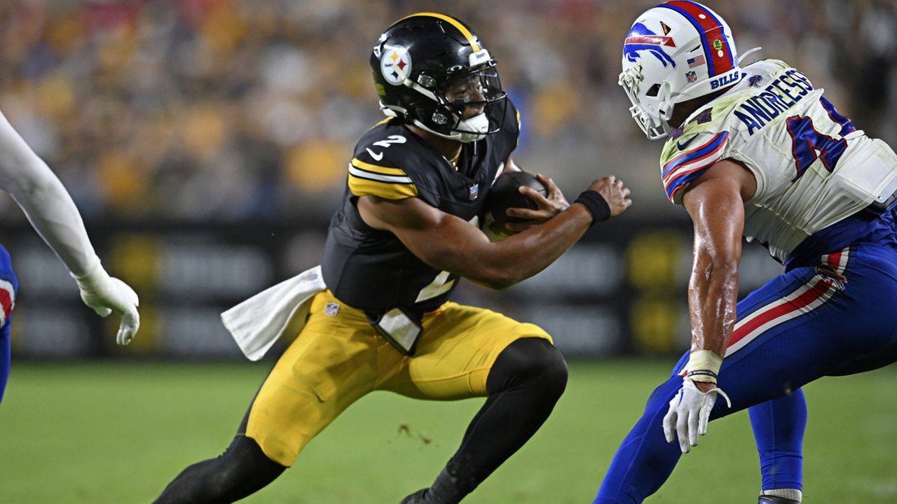 Pittsburgh Steelers quarterback Justin Fields (2) runs with the ball as Buffalo Bills linebacker Joe Andreessen (44) defends during the second half of an NFL preseason football game, Saturday, Aug. 17, 2024, in Pittsburgh. (AP Photo/David Dermer)