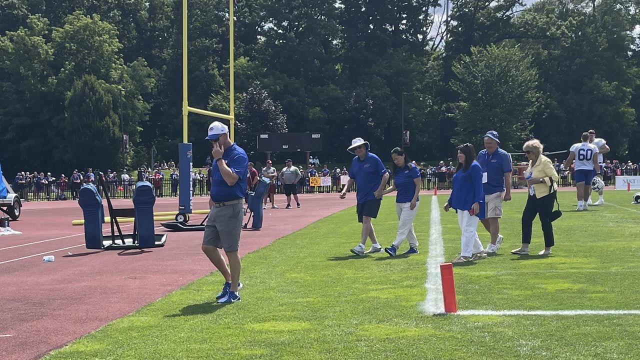 Bills co-owner Kim Pegula helps break team huddle