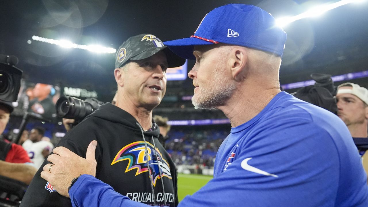 Baltimore Ravens head coach John Harbaugh, left, talks with Buffalo Bills head coach Sean McDermott following an NFL football game, Sunday, Sept. 29, 2024, in Baltimore. The Ravens won 35-10. (AP Photo/Stephanie Scarbrough)