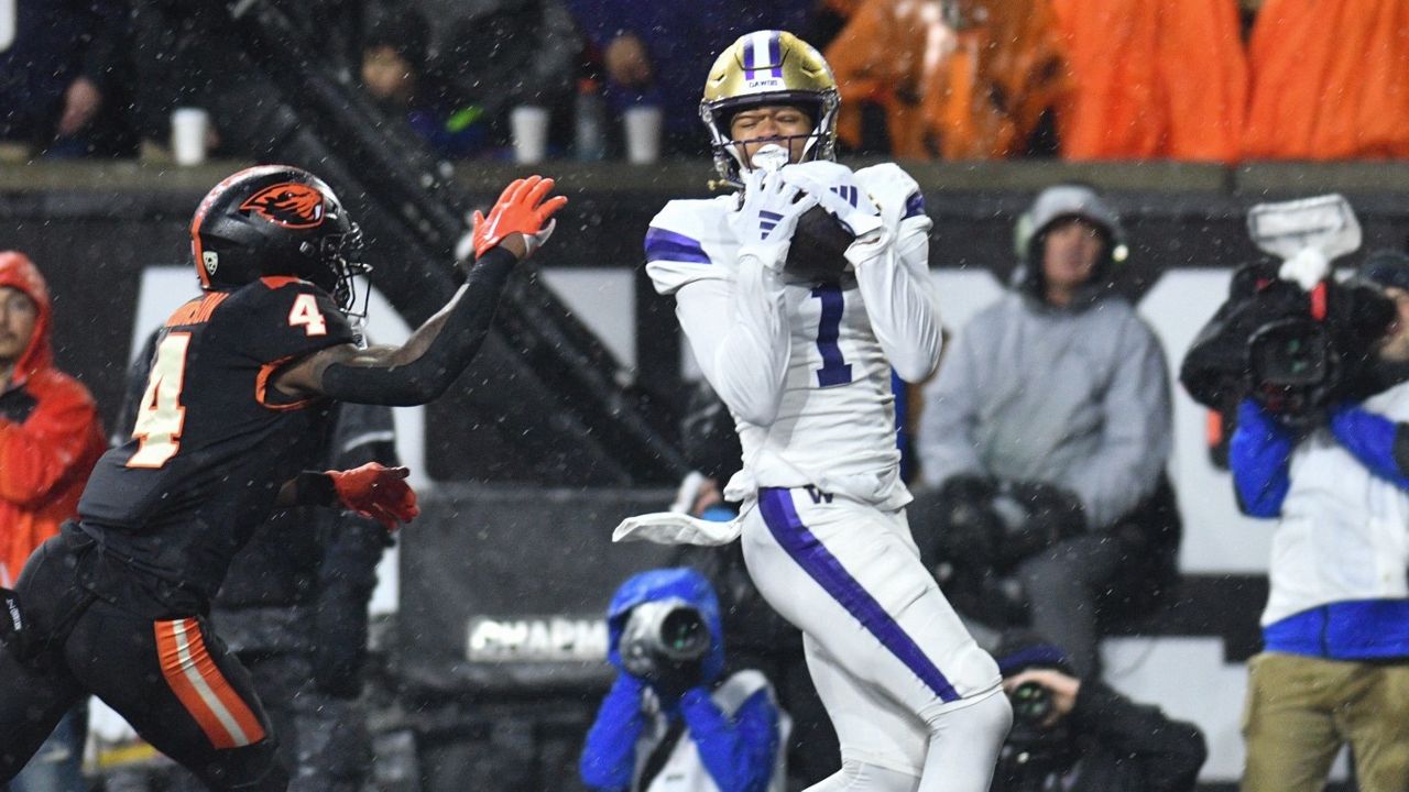 Washington wide receiver Rome Odunze (1) catches a pass. (AP Photo/Mark Ylen)