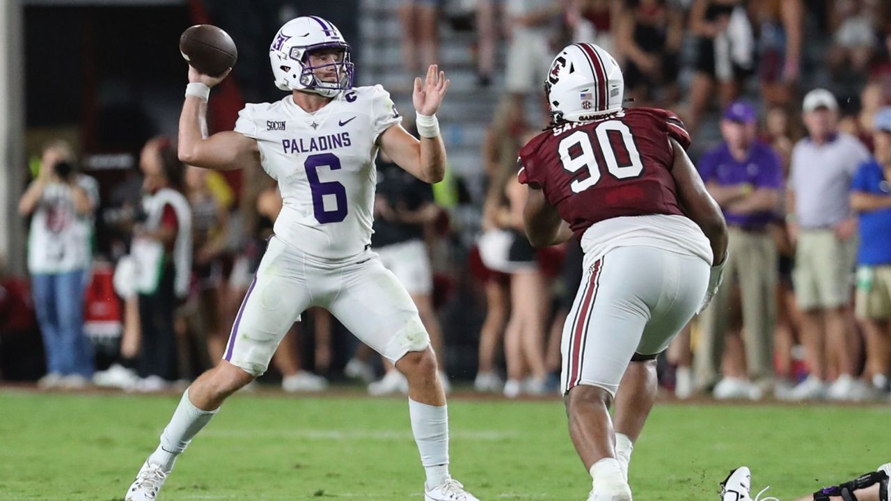 Furman quarterback Tyler Huff (6) is pressured by South Carolina defensive tackle T.J. Sanders (90) during the second half of an NCAA college football game Saturday, Sept. 9, 2023, in Columbia, S.C. (AP Photo/Artie Walker Jr.)