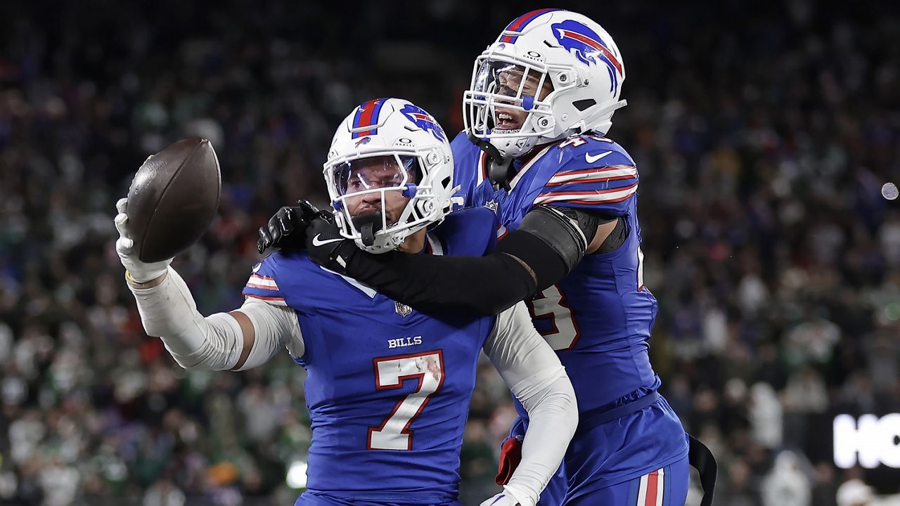 Buffalo Bills cornerback Taron Johnson (7) is congratulated by linebacker Terrel Bernard after intercepting a pass during the second half of an NFL football game against the New York Jets in East Rutherford, N.J., Monday, Oct. 14, 2024. (AP Photo/Adam Hunger)