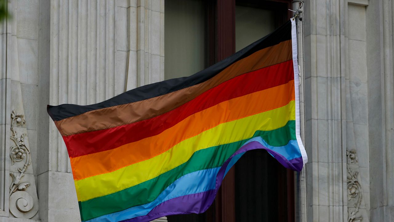 In this Monday, June 19, 2017, Philadelphia's altered gay pride flag is seen outside City Hall. (AP Photo/Matt Slocum)
