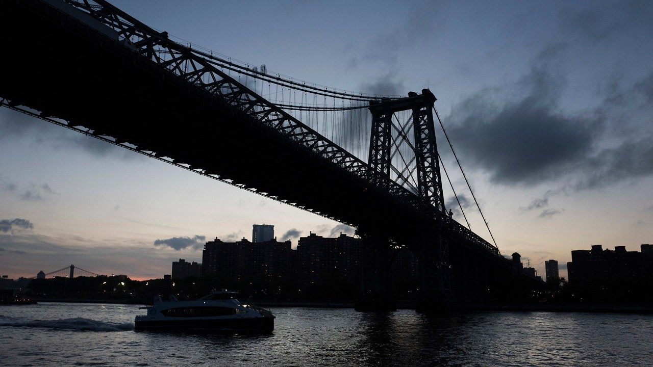 The Williamsburg Bridge is seen from a ferry on the East River, Oct. 10, 2018 in New York. The bridge, which connects Manhattan and Brooklyn, opened in 1903. (AP Photo/Mark Lennihan)
