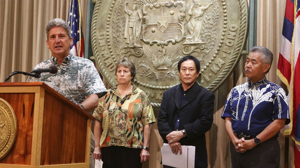 University of Hawaii President David Lassner, left, speaks at a news conference on Tuesday, Oct. 30, 2018 in Honolulu (AP News / Audrey McAvoy)