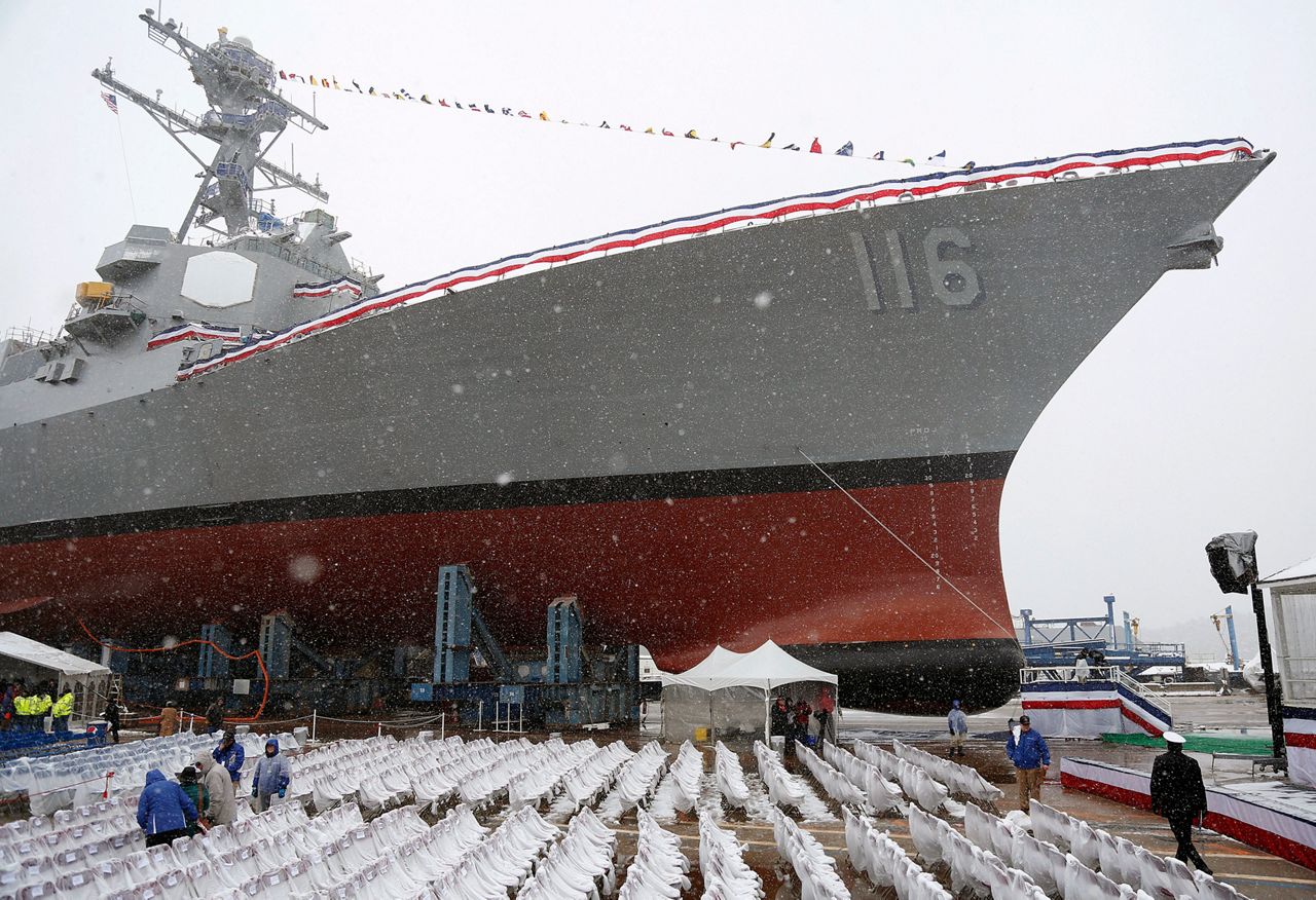 FILE - In this April 1, 2017 file photo, snow falls on the future USS Thomas Hudner, a U.S. Navy destroyer named after Korean War veteran Thomas Hudner, during christening ceremony at Bath Iron Works in Bath, Maine. (AP Photo/Mary Schwalm, File)