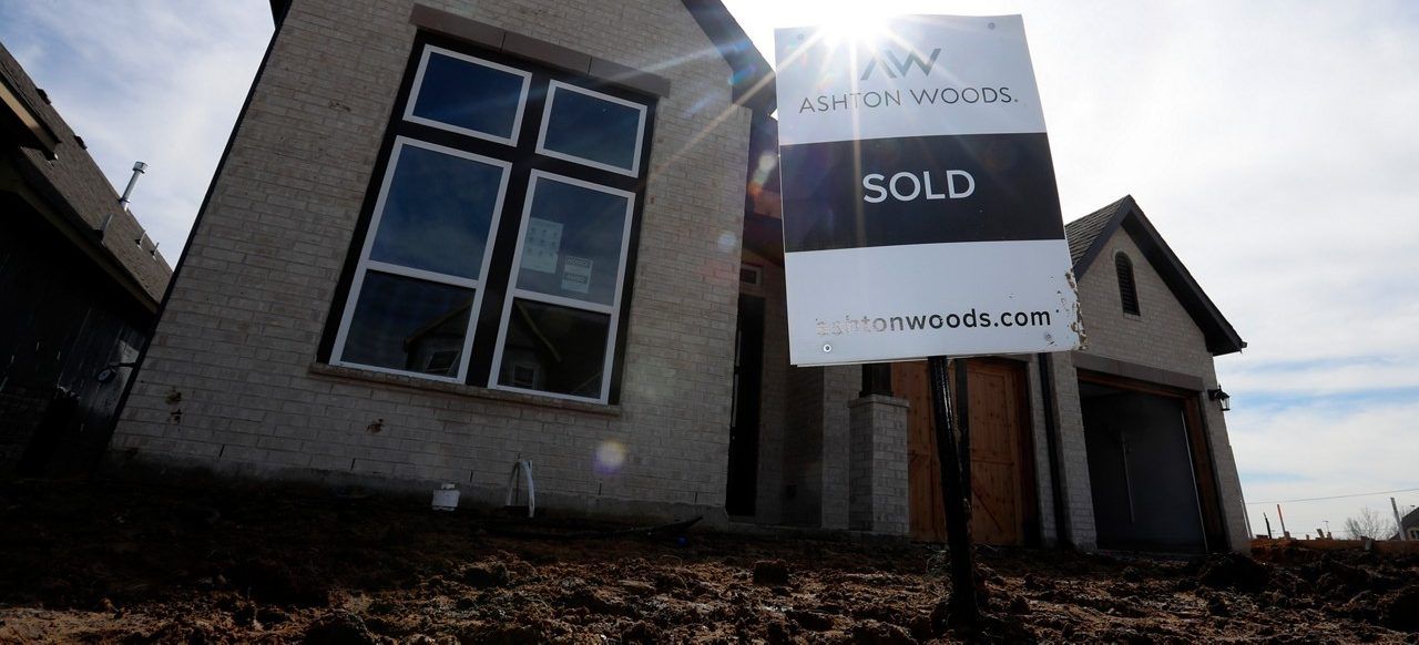 In this photo made Wednesday, Feb. 20, 2019, a just completed home sits with a sold sign in front in north Dallas. (AP Photo/LM Otero)
