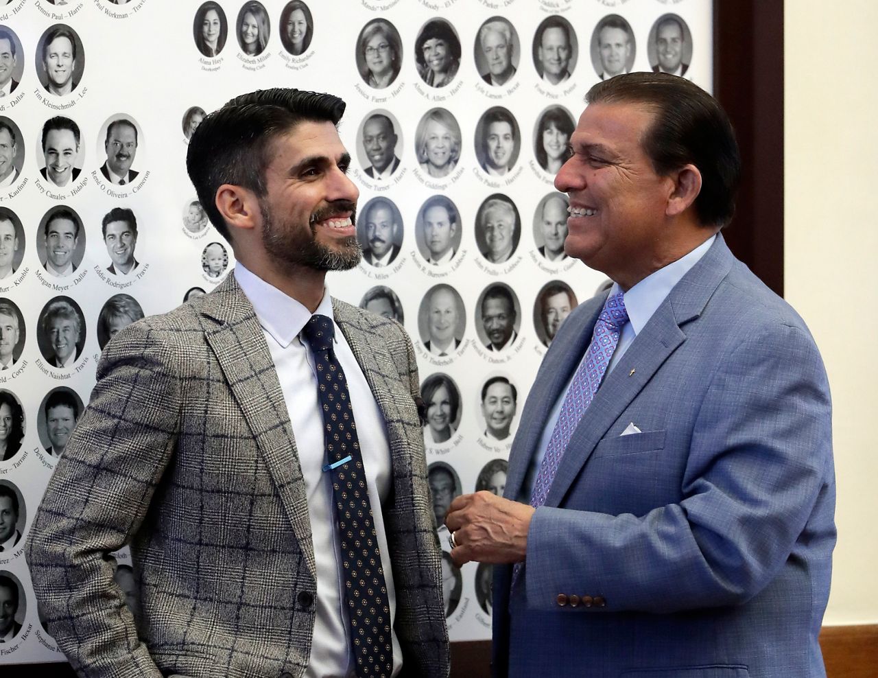Texas Rep. Eddie Lucio III, D-Brownsville, left, visits with his father Texas Sen. Eddie Lucia Jr., D-Brownsville, right, in the House Chamber, Tuesday, May 23, 2017, in Austin. (AP Photo/Eric Gay)