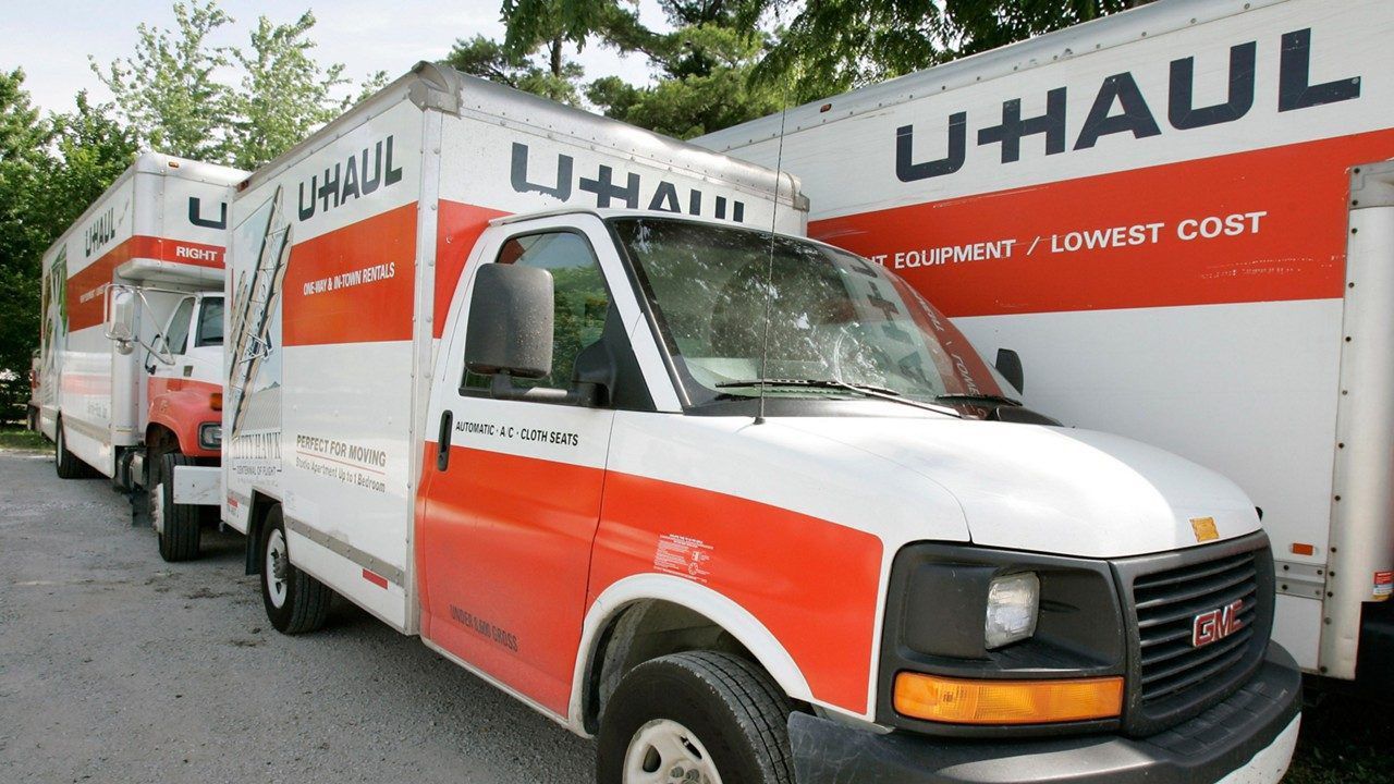 In this June 14, 2006 file photo are U-Haul trucks sit on a dealer lot in Des Moines, Iowa. (AP Photo/Charlie Neibergall, File)