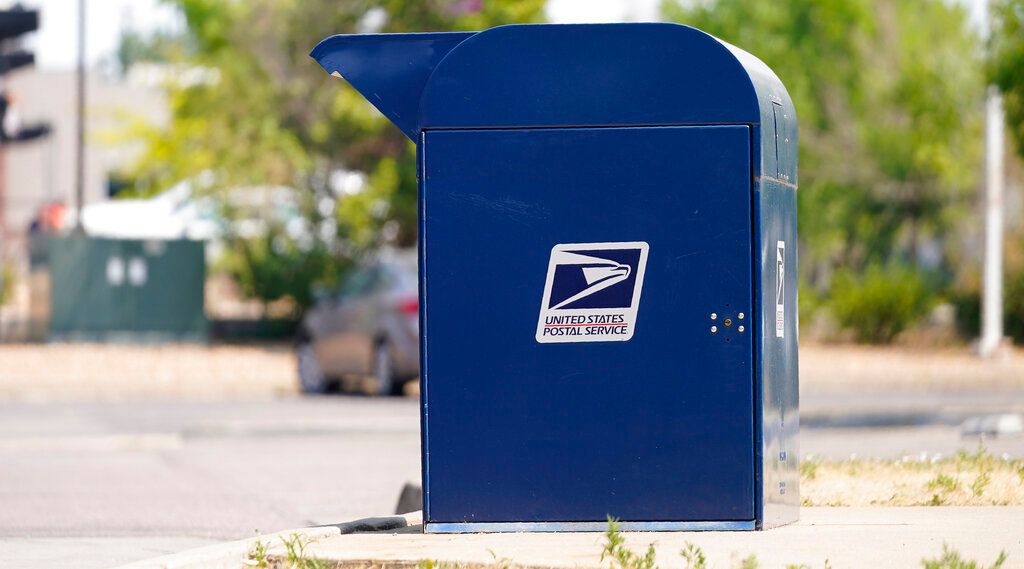 A mailbox outside a United States Postal Service location Monday, Aug. 17, 2020, in southeast Denver. (AP Photo/David Zalubowski)