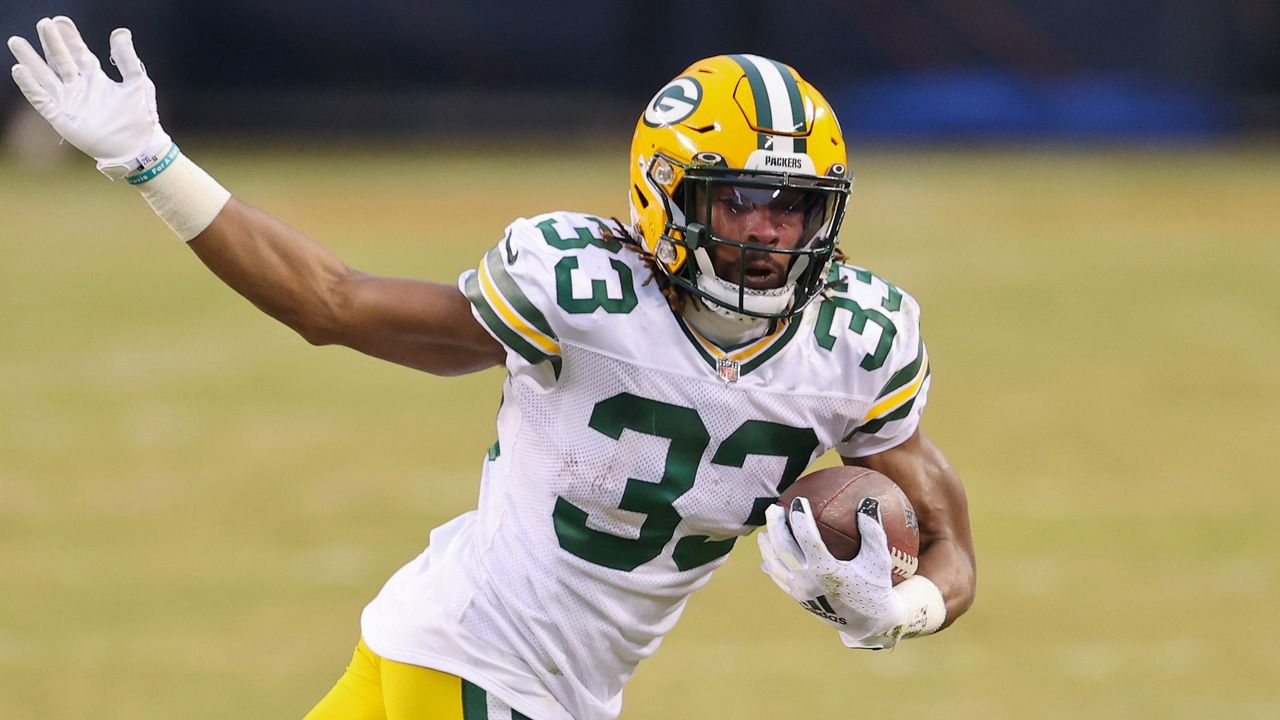 September 18, 2022: Green Bay Packers running back Aaron Jones (33) does  the first Lambeau Leap of the 2022 season after his first touchdown during  the NFL football game between the Chicago