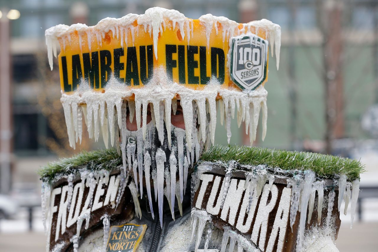 Green Bay Packers fan, Frozen Tundra Man looks on during the