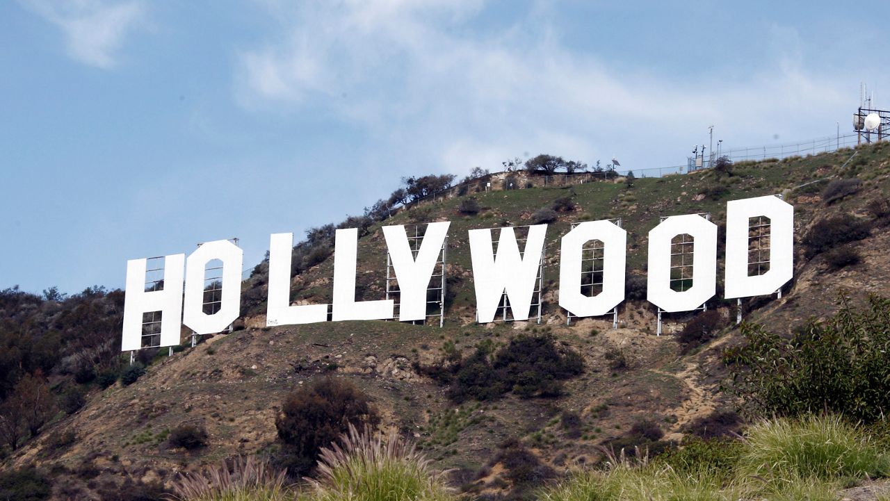 The Hollywood sign appears near the top of Beachwood Canyon adjacent to Griffith Park in the Hollywood Hills of Los Angeles on Jan. 29,2010. (AP Photo/Reed Saxon)